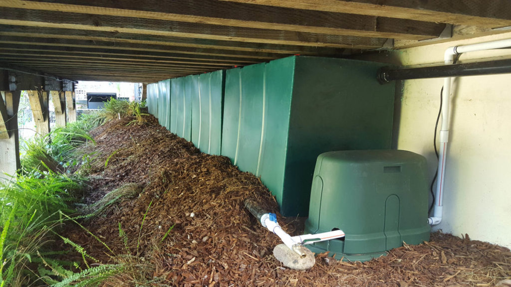 concealed rainwater storage tanks under deck