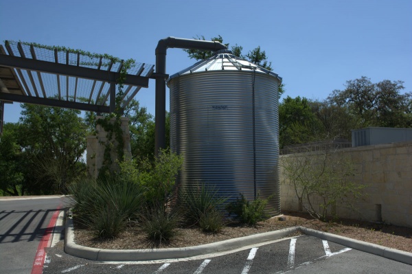 corgal water storage tanks in parking lot